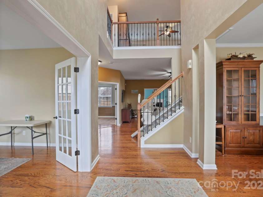 243 Wildbriar Road, Fletcher, NC 28732.  MLS# CAR4240300, YatesRealty ID 20721. View as you enter the front door. Study to your left, dining room to the right, and straight ahead to the open concept living room, kitchen, and sunroom.
