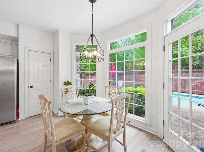 7014 Walton Heath Lane, Charlotte, NC 28277.  MLS# CAR4376806, YatesRealty ID 20725. Imagine having breakfast while gazing out at your shimmering and refreshing in-ground pool! Just step out to your charming outdoor living area!