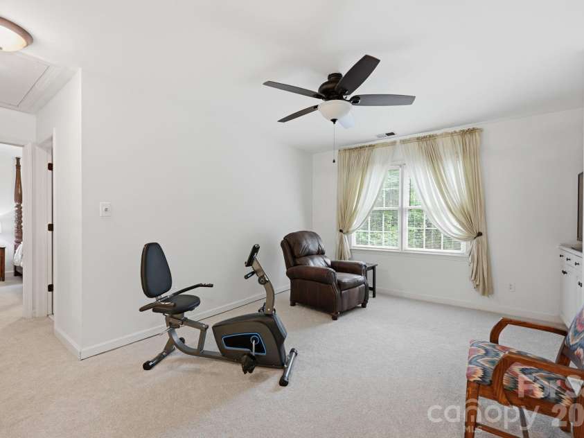 7014 Walton Heath Lane, Charlotte, NC 28277.  MLS# CAR4376806, YatesRealty ID 20725. The versatile Loft can be used as an exercise, reading or play area - whatever fits your lifestyle! Guest Bedroom #1 is down the hall.