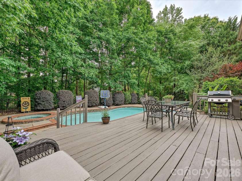 17405 Lynx Den Court, Davidson, NC 28036.  MLS# CAR4377973, YatesRealty ID 20726. Spacious deck overlooking the private backyard oasis, offering the perfect setting for outdoor dining, entertaining, and relaxing.