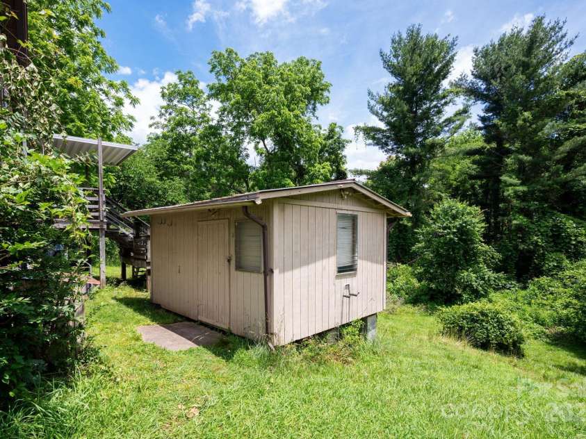 70 Galax Avenue, Asheville, NC 28806.  MLS# CAR4264175, YatesRealty ID 20726. Shed with electrical conveys