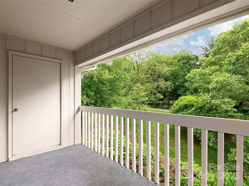 304 Abbey Circle, Asheville, NC 28805.  MLS# CAR4260740, YatesRealty ID 2073. Covered deck with storage closest