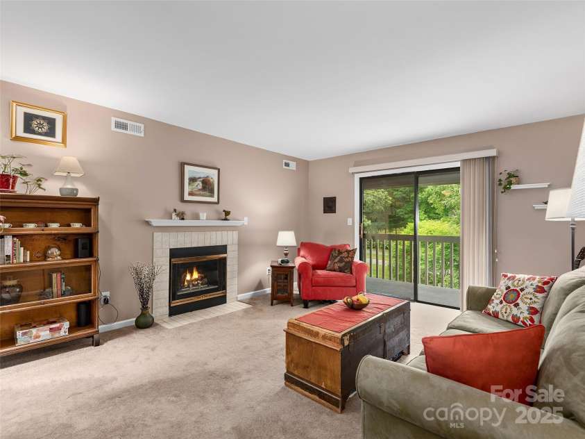 304 Abbey Circle, Asheville, NC 28805.  MLS# CAR4260740, YatesRealty ID 2073. Living area looking onto covered deck