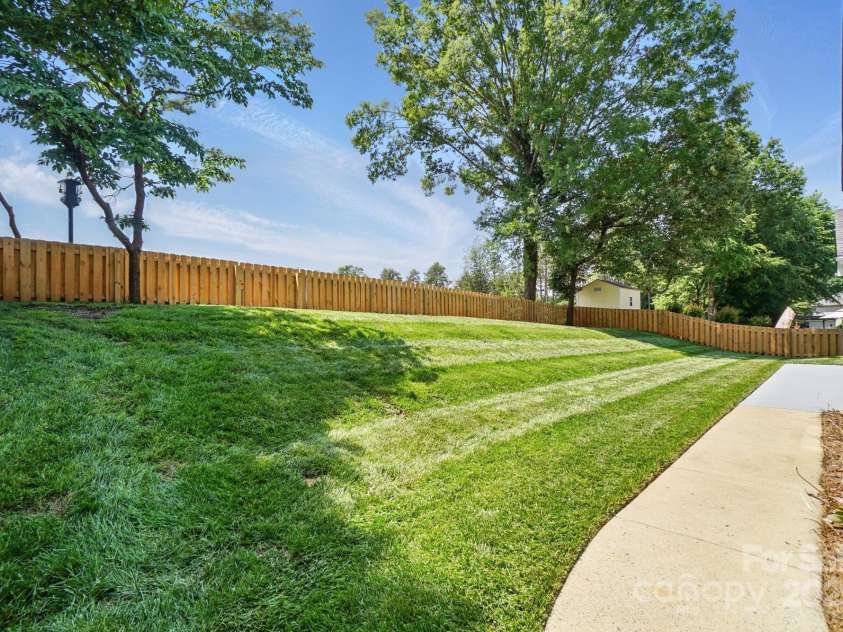 146 Burtons Barn Road, Mooresville, NC 28115.  MLS# CAR4257807, YatesRealty ID 20739. New Fenced Yard