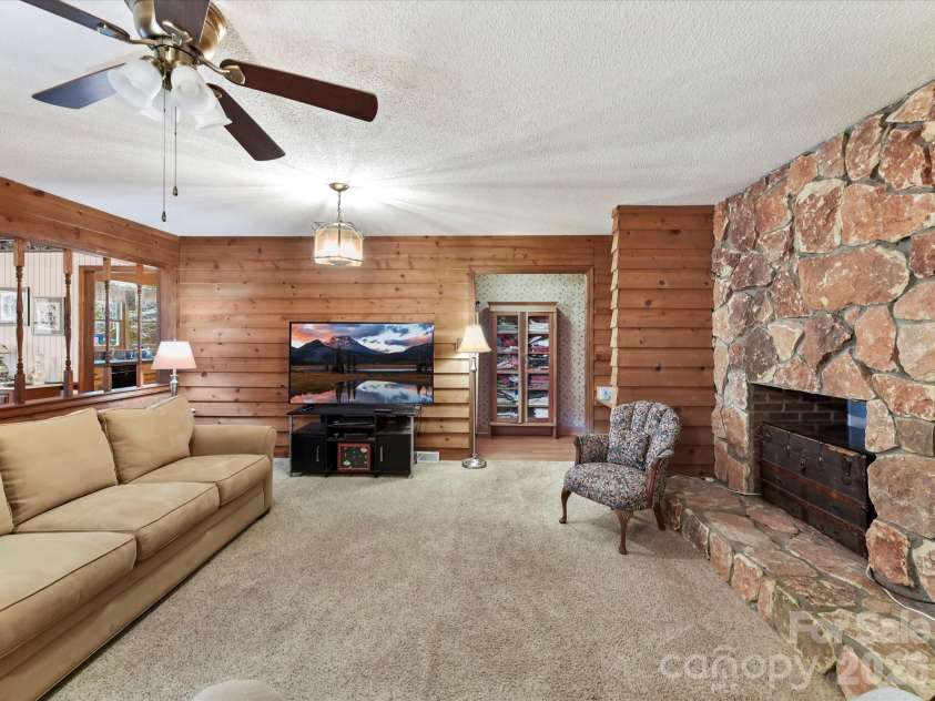 10803 Chestnut Hill Drive, Matthews, NC 28105.  MLS# CAR4332333, YatesRealty ID 2074. Roomy Great Room features impressive, stone surround, gas fireplace & ceiling fan/light!