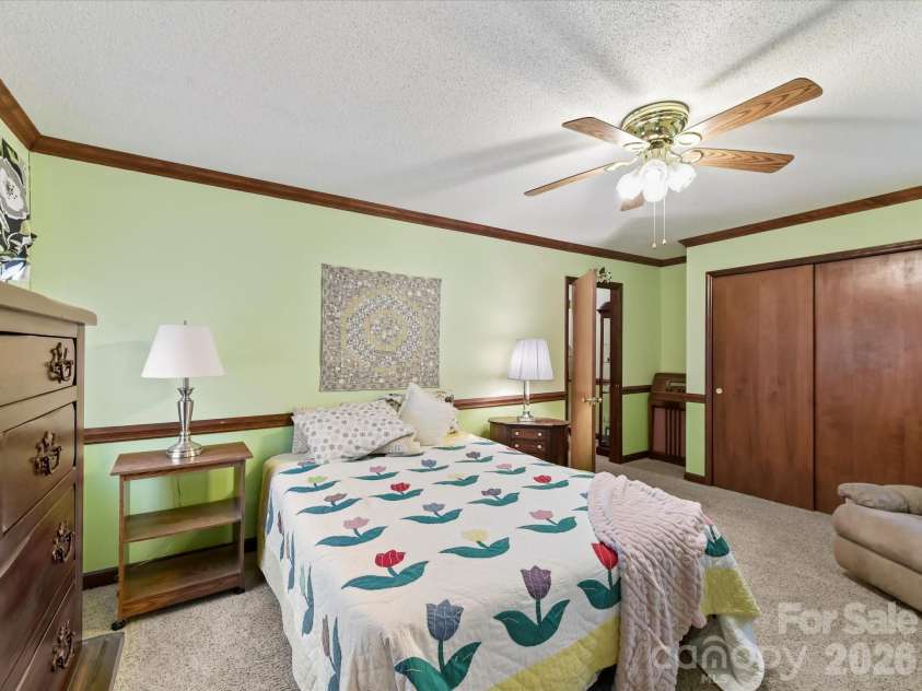 10803 Chestnut Hill Drive, Matthews, NC 28105.  MLS# CAR4332333, YatesRealty ID 2074. Spacious Bedroom 2 wtih ceiling fan/light!