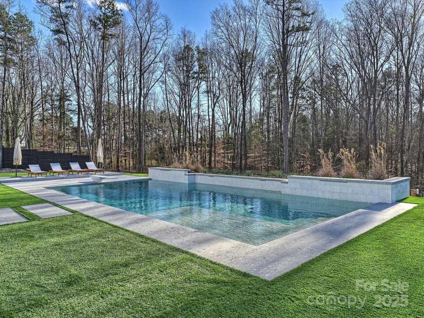 1525 Shinnville Road, Cleveland, NC 27013.  MLS# CAR4249385, YatesRealty ID 2074. Backyard featuring saltwater pool and turf 