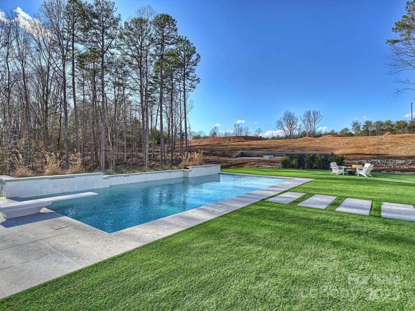 1525 Shinnville Road, Cleveland, NC 27013.  MLS# CAR4249385, YatesRealty ID 2074. Backyard featuring saltwater pool and turf