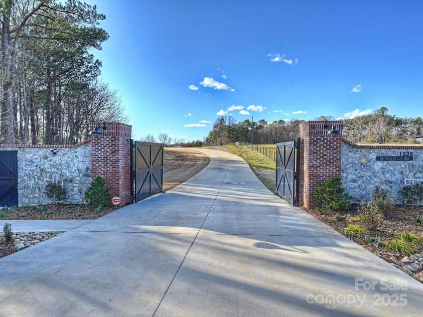 1525 Shinnville Road, Cleveland, NC 27013.  MLS# CAR4249385, YatesRealty ID 2074. Gated Driveway Entrance