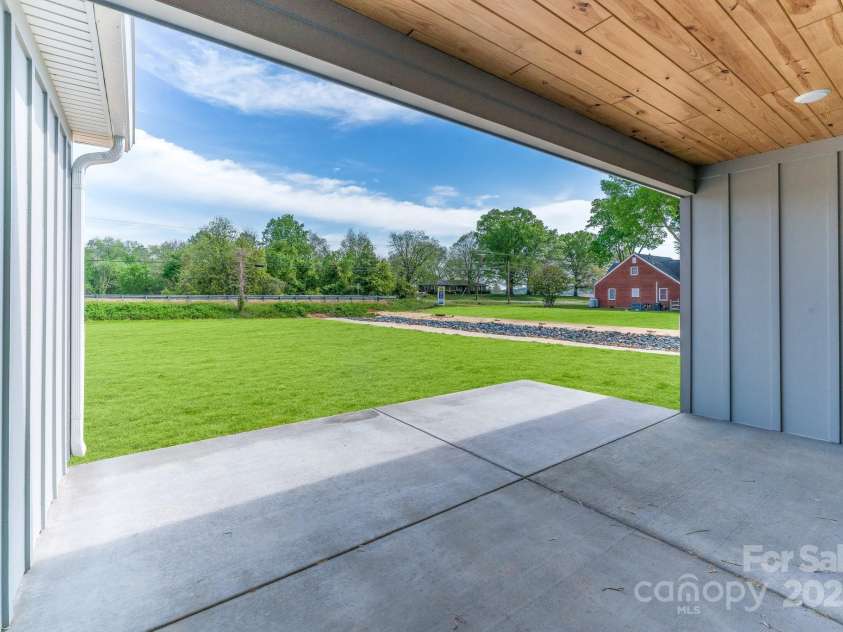 28655-A NC Hwy 73 Highway, Albemarle, NC 28001.  MLS# CAR4246876, YatesRealty ID 20741. Covered Rear Porch NOTE: ALL PICS ARE OF PREVIOUS BUILDS This home will have a Vinyl Exterior