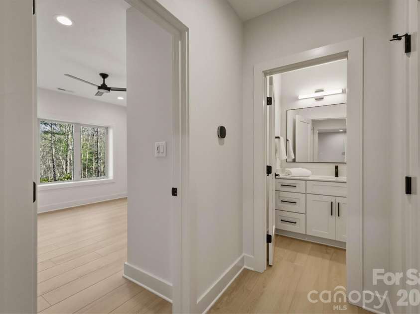 173 Waters Edge Drive, Nebo, NC 28761.  MLS# CAR4364596, YatesRealty ID 20742. A third bathroom is accessible from bedroom Suite #3 and serves as the guest bathroom for this level.