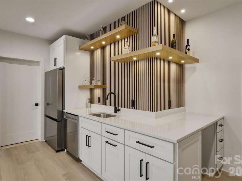 173 Waters Edge Drive, Nebo, NC 28761.  MLS# CAR4364596, YatesRealty ID 20742. Floating shelves are there for your decorative items or bar 