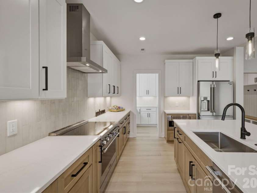 173 Waters Edge Drive, Nebo, NC 28761.  MLS# CAR4364596, YatesRealty ID 20742. Here is a different view of the kitchen with a peek into the walk-in pantry. 