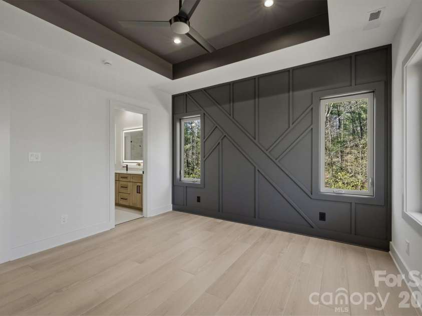 173 Waters Edge Drive, Nebo, NC 28761.  MLS# CAR4364596, YatesRealty ID 20742. Here is a little different view of the owners' suite and the door into the owners' ensuite bathroom.