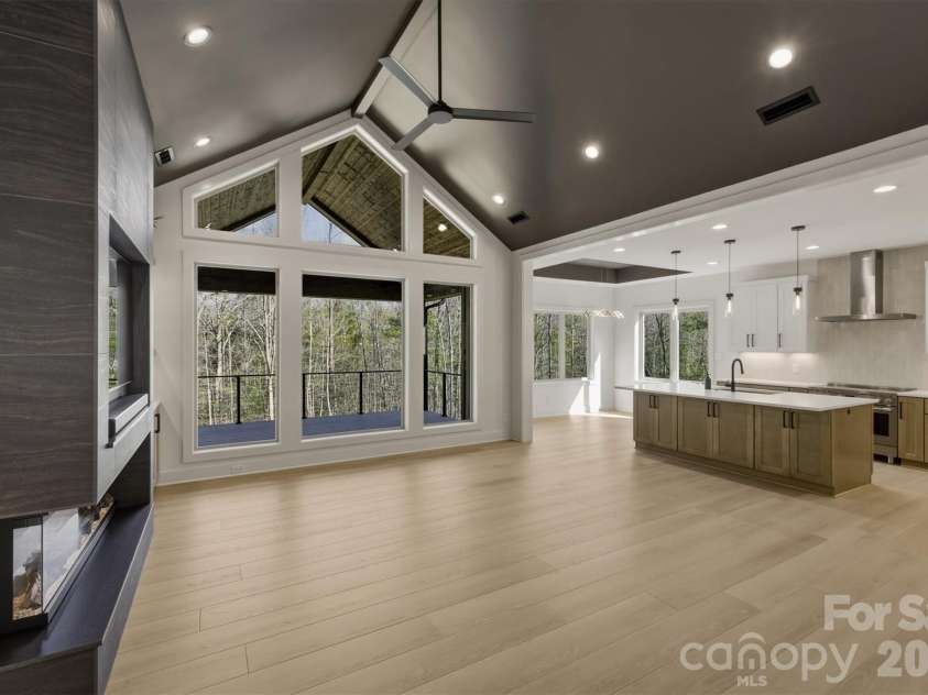 173 Waters Edge Drive, Nebo, NC 28761.  MLS# CAR4364596, YatesRealty ID 20742. The floor plan is very open. The views out the large glass 