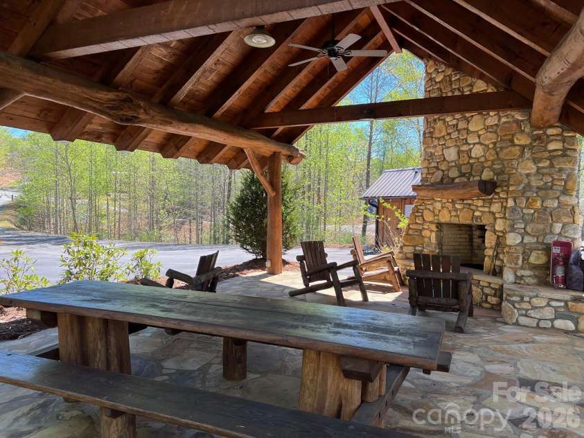 173 Waters Edge Drive, Nebo, NC 28761.  MLS# CAR4364596, YatesRealty ID 20742. There are many amenities for The Arbor at Lake James. Here is one of them....the covered pavilion with a stone fireplace and picnic tables. 