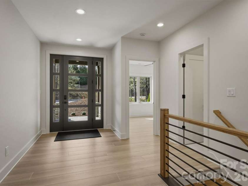173 Waters Edge Drive, Nebo, NC 28761.  MLS# CAR4364596, YatesRealty ID 20742. Upon entry, the contemporary design welcomes you. The extra wide flooring is COREtec Originals Premium (Soft Step) collection 9
