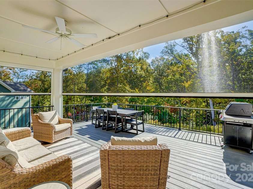 4116 Spring Cove Way, Belmont, NC 28012.  MLS# CAR4326740, YatesRealty ID 20747. Covered deck with electric remote screen is perfect for entertaining