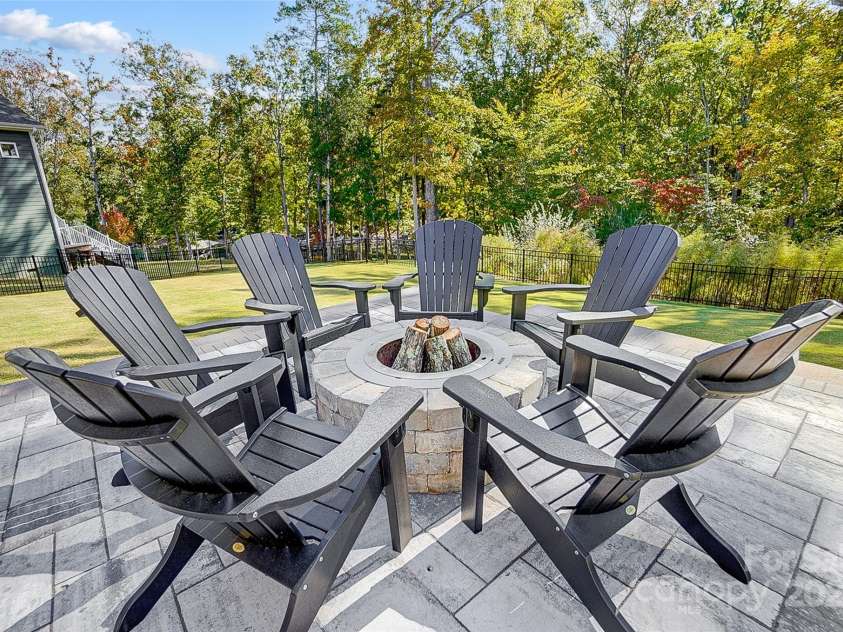 4116 Spring Cove Way, Belmont, NC 28012.  MLS# CAR4326740, YatesRealty ID 20747. Gather around the firepit on cool evenings