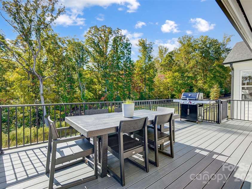 4116 Spring Cove Way, Belmont, NC 28012.  MLS# CAR4326740, YatesRealty ID 20747. Live outdoors on the fabulous covered patio or deck, gather around the firepit on cool evenings, or enjoy watersports from your floating dock!