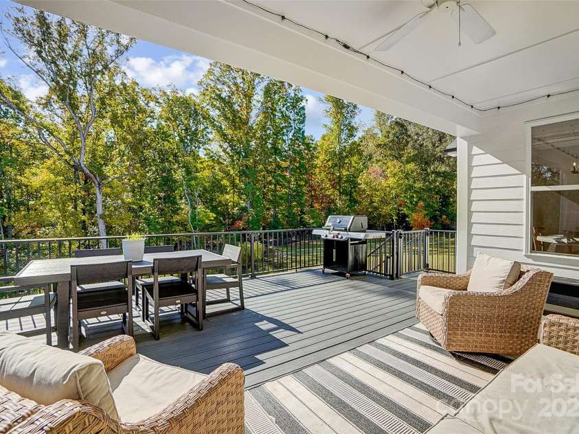 4116 Spring Cove Way, Belmont, NC 28012.  MLS# CAR4326740, YatesRealty ID 20747. You’ll spend hours lingering over morning coffee, reading a book, or relaxing & enjoying the lake views from the covered back deck