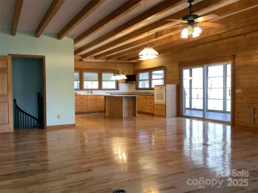 124 Baconton Cove, Waynesville, NC 28786.  MLS# CAR4241453, YatesRealty ID 20752. Kitchen living room with interior access to downstairs