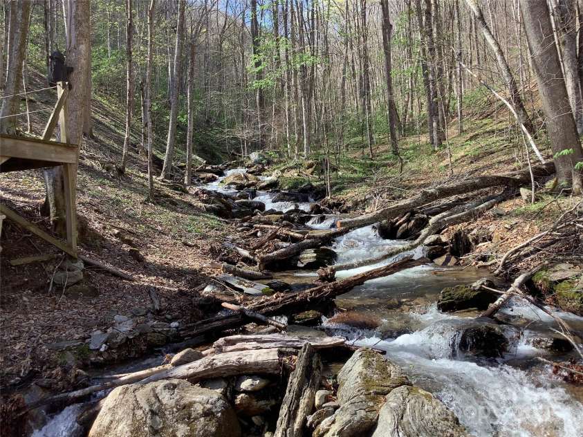 124 Baconton Cove, Waynesville, NC 28786.  MLS# CAR4241453, YatesRealty ID 20752. Rare +-500 feet of creek frontage