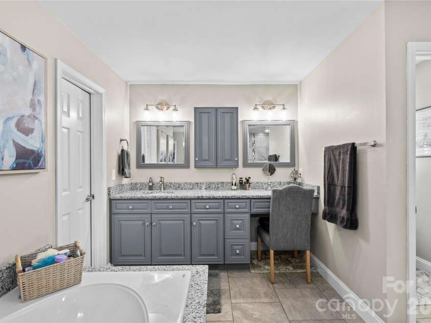 483 Heather Marie Drive, Hendersonville, NC 28792.  MLS# CAR4367948, YatesRealty ID 20764. Large updated primary bathroom on upper level