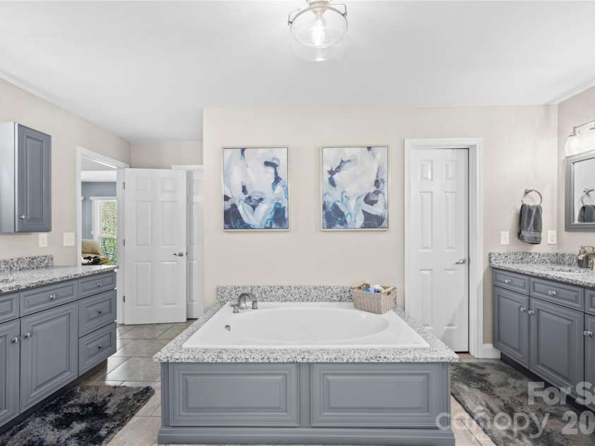 483 Heather Marie Drive, Hendersonville, NC 28792.  MLS# CAR4367948, YatesRealty ID 20764. Large updated primary bathroom on upper level