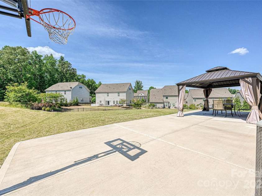 9937 Travertine Trail, Davidson, NC 28036.  MLS# CAR4238820, YatesRealty ID 20766. View of yard before trees were added