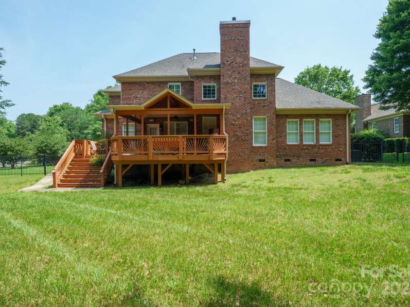 100 Woodwinds Drive, Mount Holly, NC 28120.  MLS# CAR4261214, YatesRealty ID 20775. Back of House