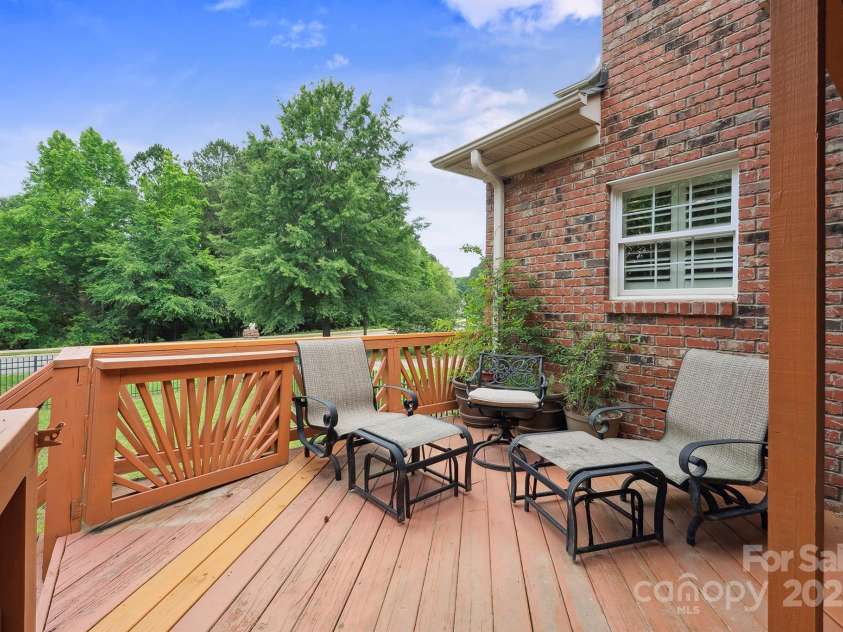 100 Woodwinds Drive, Mount Holly, NC 28120.  MLS# CAR4261214, YatesRealty ID 20775. Back of House