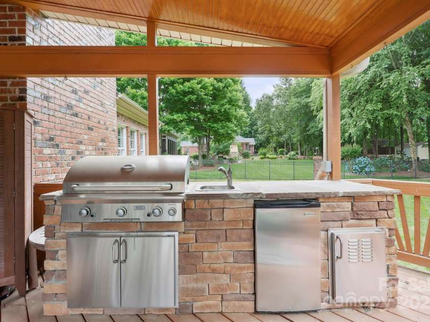 100 Woodwinds Drive, Mount Holly, NC 28120.  MLS# CAR4261214, YatesRealty ID 20775. Back of House