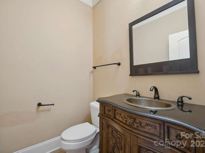 100 Woodwinds Drive, Mount Holly, NC 28120.  MLS# CAR4261214, YatesRealty ID 20775. Main level 1/2 bath