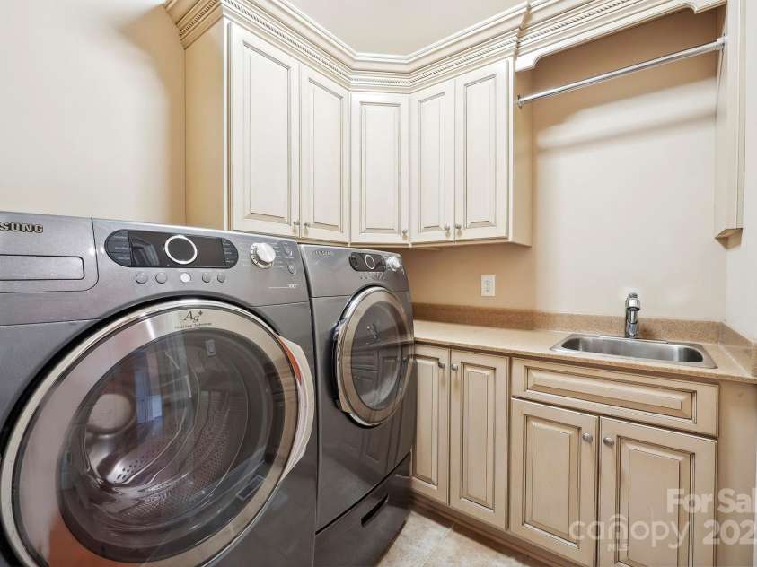 100 Woodwinds Drive, Mount Holly, NC 28120.  MLS# CAR4261214, YatesRealty ID 20775. Main level Laundry Room with sink