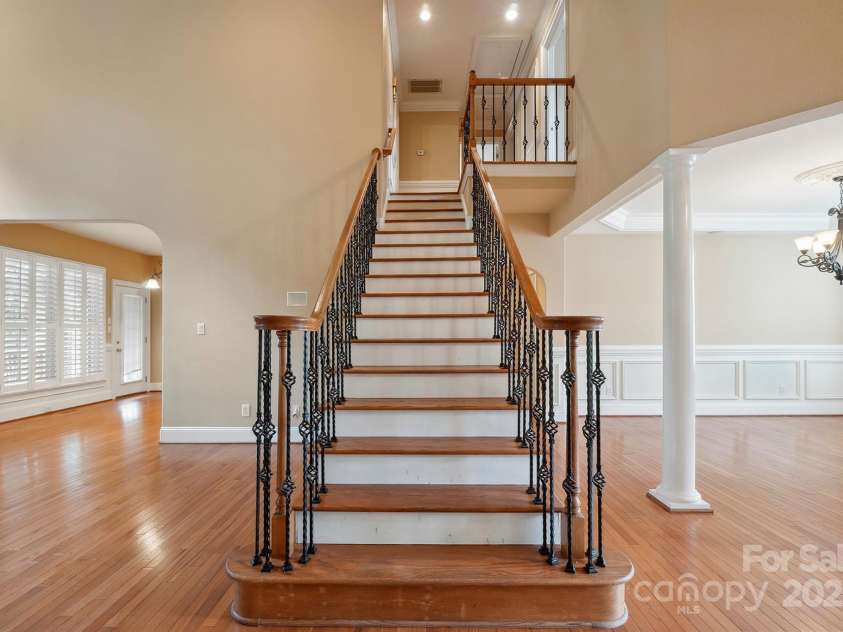 100 Woodwinds Drive, Mount Holly, NC 28120.  MLS# CAR4261214, YatesRealty ID 20775. Stairs to second level