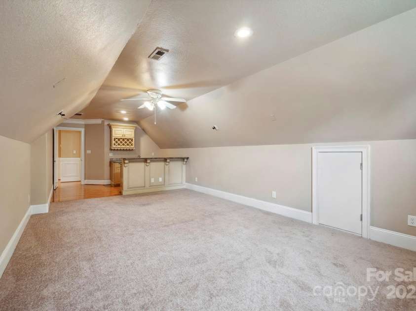 100 Woodwinds Drive, Mount Holly, NC 28120.  MLS# CAR4261214, YatesRealty ID 20775. Upper level Bonus Room