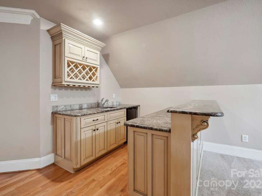 100 Woodwinds Drive, Mount Holly, NC 28120.  MLS# CAR4261214, YatesRealty ID 20775. Upper level Bonus Room - Wet Bar area