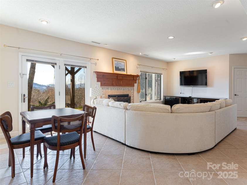 142 Twin Courts Drive, Weaverville, NC 28787.  MLS# CAR4222698, YatesRealty ID 20779. Lower level den