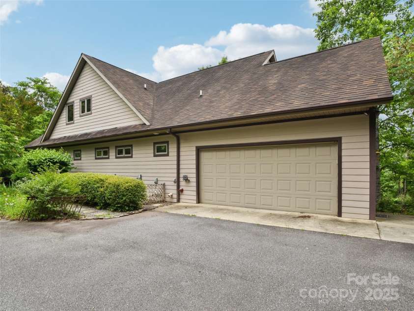142 Twin Courts Drive, Weaverville, NC 28787.  MLS# CAR4222698, YatesRealty ID 20779. Main level two car garage