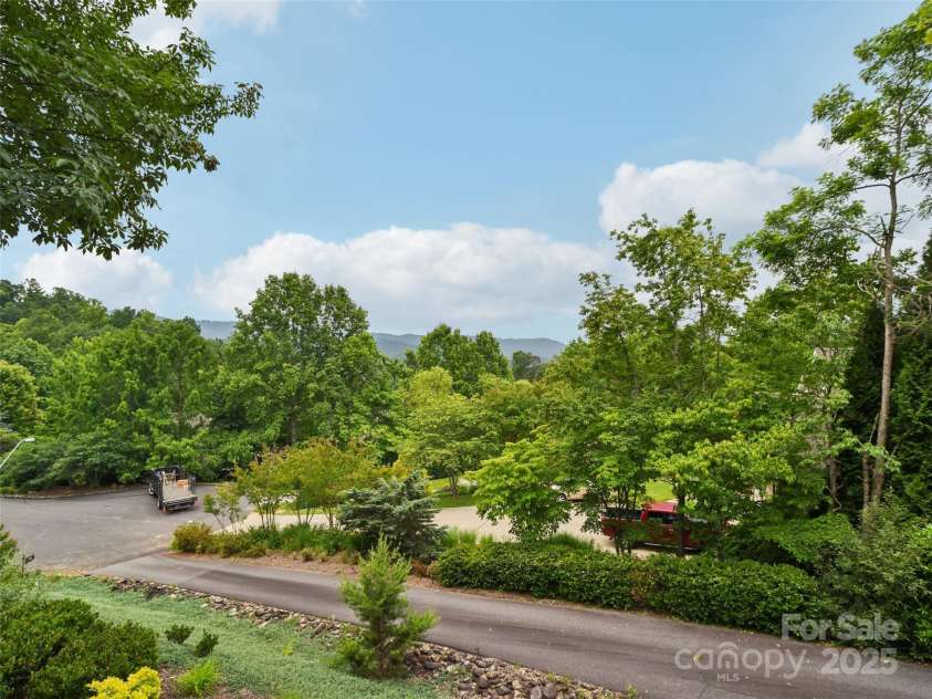 142 Twin Courts Drive, Weaverville, NC 28787.  MLS# CAR4222698, YatesRealty ID 20779. Mid Range summer views
