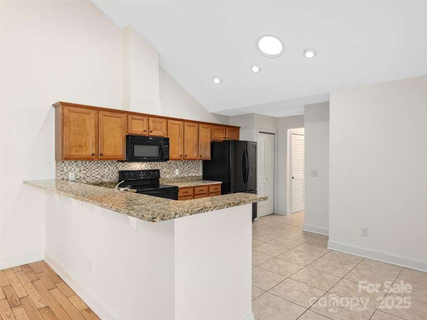 354 Summerfield Place, Flat Rock, NC 28731.  MLS# CAR4165363, YatesRealty ID 2078. Kitchen with Breakfast Bar