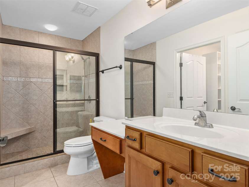 354 Summerfield Place, Flat Rock, NC 28731.  MLS# CAR4165363, YatesRealty ID 2078. Primary with step in shower and adjacent walk in closet