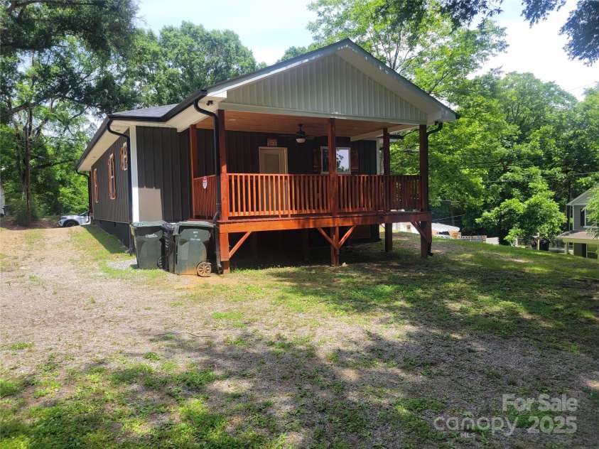 94 James Street, Concord, NC 28025.  MLS# CAR4271265, YatesRealty ID 20782. Back of home - shows driveway enter from front or back