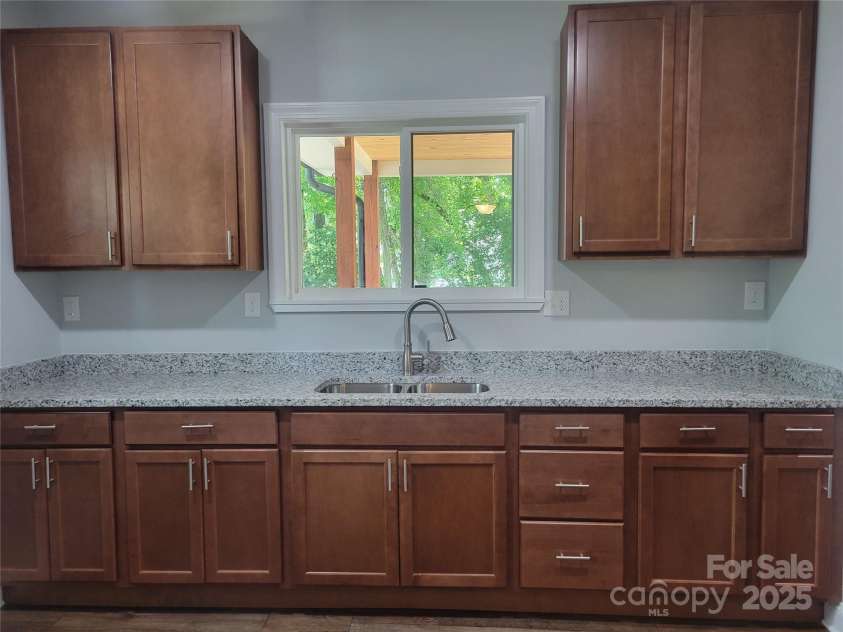 94 James Street, Concord, NC 28025.  MLS# CAR4271265, YatesRealty ID 20782. Kitchen ss sink with natural light