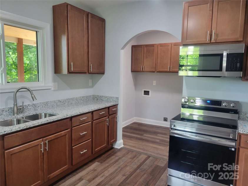 94 James Street, Concord, NC 28025.  MLS# CAR4271265, YatesRealty ID 20782. Kitchen with SS appliances