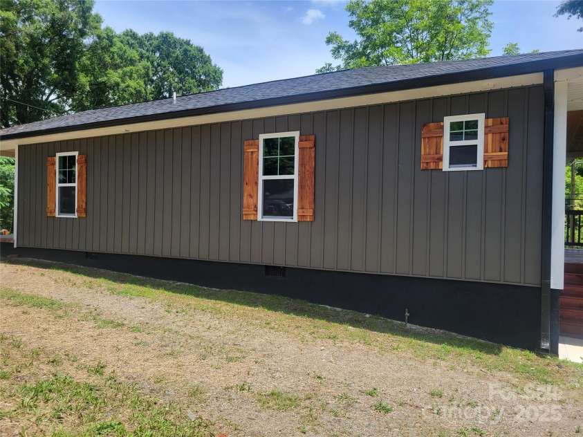 94 James Street, Concord, NC 28025.  MLS# CAR4271265, YatesRealty ID 20782. Side of home