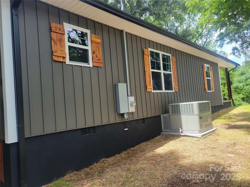 94 James Street, Concord, NC 28025.  MLS# CAR4271265, YatesRealty ID 20782. Side view with HVAC