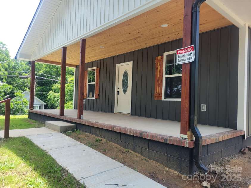 94 James Street, Concord, NC 28025.  MLS# CAR4271265, YatesRealty ID 20782. Sidewalk leading to Front covered concrete porch to sit and enjoy!!