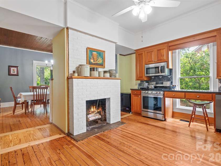 602 Main Street, Davidson, NC 28036.  MLS# CAR4376651, YatesRealty ID 20788. Charming fireplace in kitchen